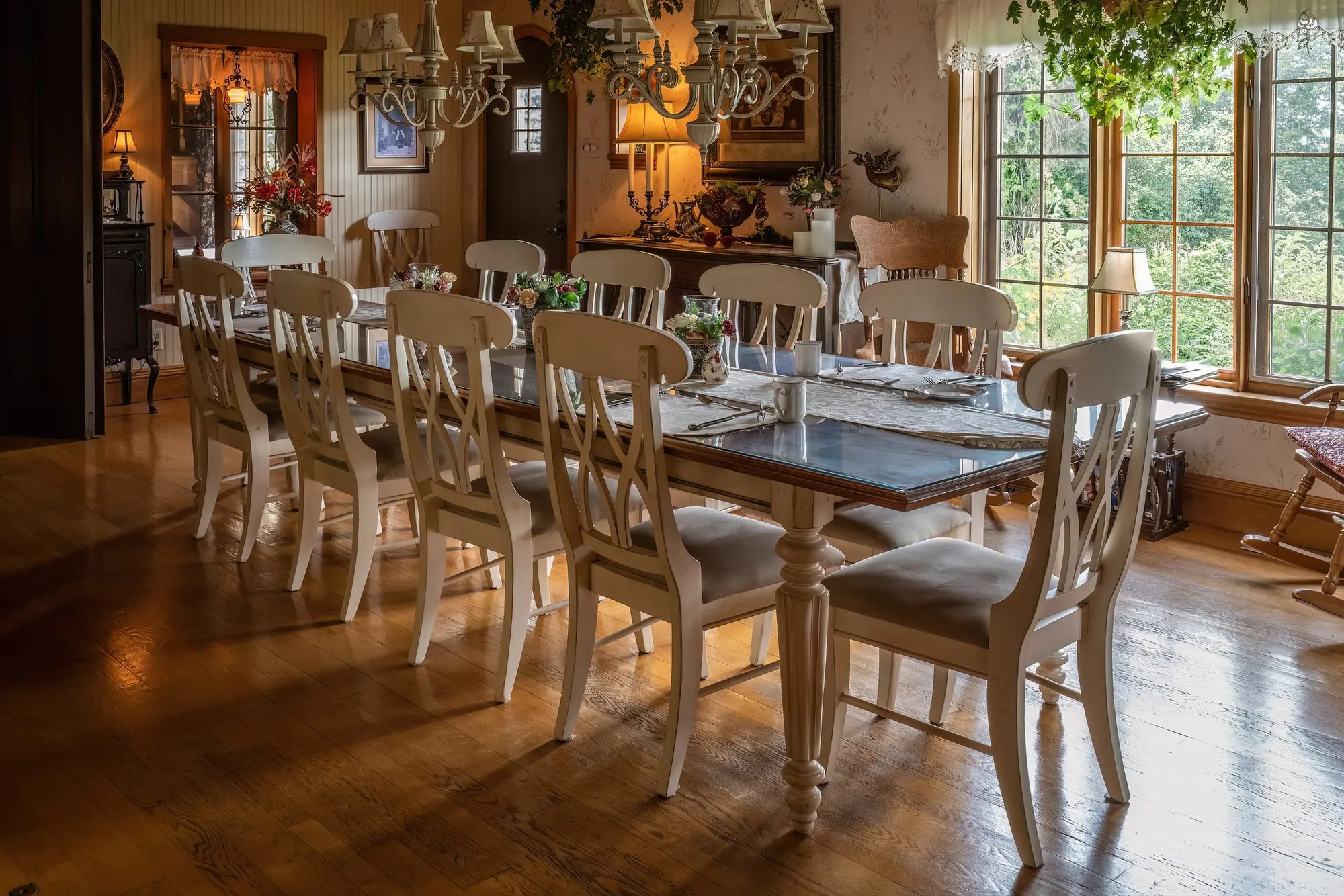 Long farmhouse dining room with wide-plank floors
