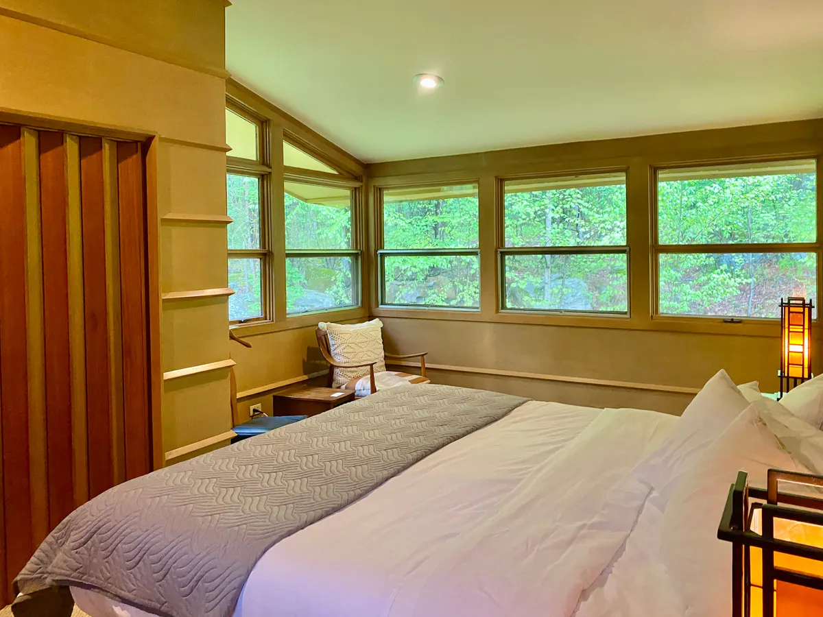 Sunny bedroom wrapped in windows